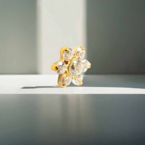 Piercing Flor 5 puntas con cristal de titanio grado implante recubierto en oro pvd